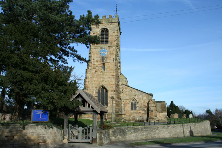 The Church of St. Helen at Ainderby Steeple (the Memorial Cross is just visible).