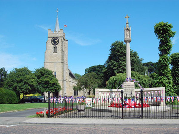 The War Memorial for Chatteris (Cambridgeshire) in front of St. Peter's Church