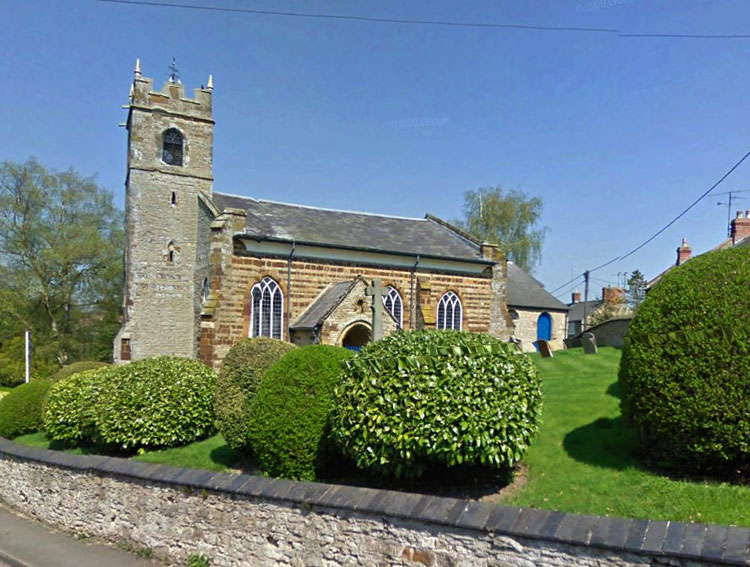 The Church of St. Margaret of Antioch, Denton (Northants), with the War Memorial just showing.