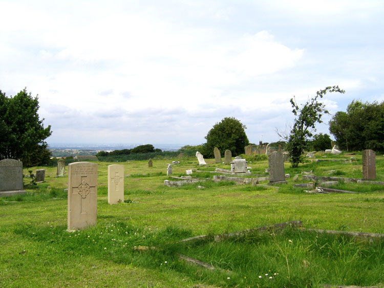 A view of Brotton Church Cemetery, looking towards Middlesbrough,A view of Brotton Church Cemetery, looking towards Middlesbrough, with the headstones for Privates Clarke and Marshall in the foreground.