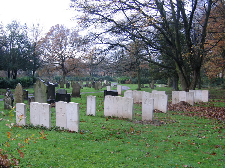 A section of Preston (New Hall lane) Cemetery, - with Private Hall's grave among the three at the rear (right).