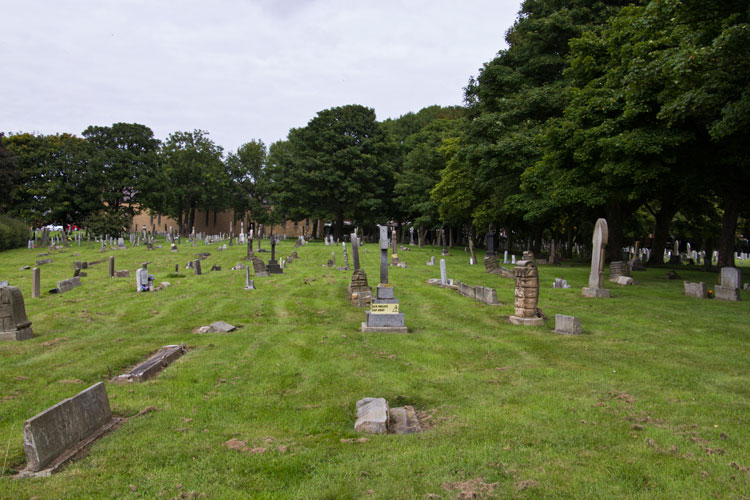 Seaton Hirst (St. John) Churchyard. Private Bell's headstone is on the right (foreground).