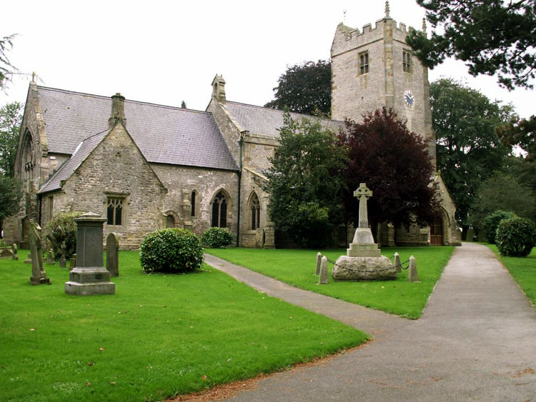 The War Memorial outside St. Michael's Church, Kirklington.