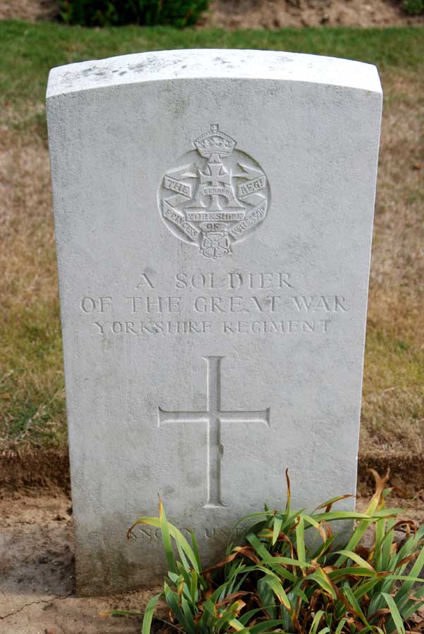 The Grave of an Unidentified Soldier of the Yorkshire Regiment, - Adanac Military Cemetery, Miraumont