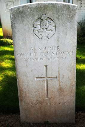 The grave of an Unknown Soldier of the Yorkshire Regiment in Buquoy Road Cemetery