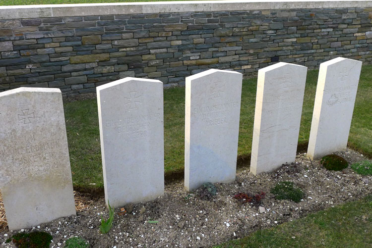 Headstones for 5 German Soldiers in Epehy Wood Farm Cemetery, including those of Unknown Soldiers (Centre 3)