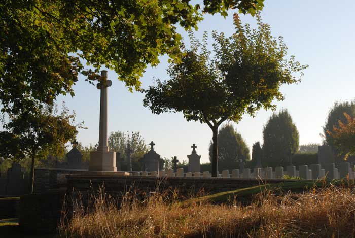 A view of the Heninel Communal Cemetery Extension, showing the Cross of Sacrifice.