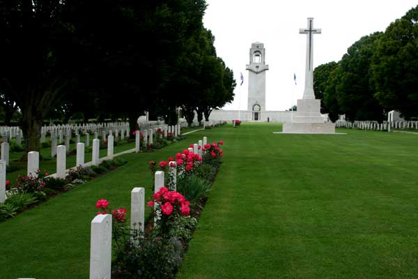 The view South through the Cemetery towards the Memorial, with the Cross of Remembrance.