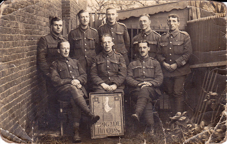 Thomas Holbrook with 7 other soldiers in "Brigade Headquarters". Thomas Holbrook on the extreme right.