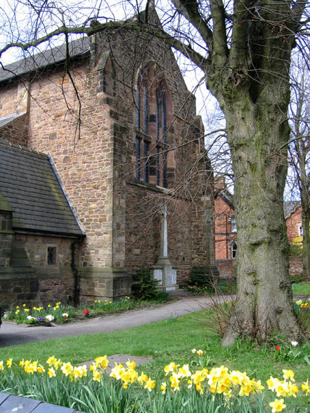 The War Memorial for Somercotes (Derbyshire) sited directly in front of the end wall of St.  Thomas's Church